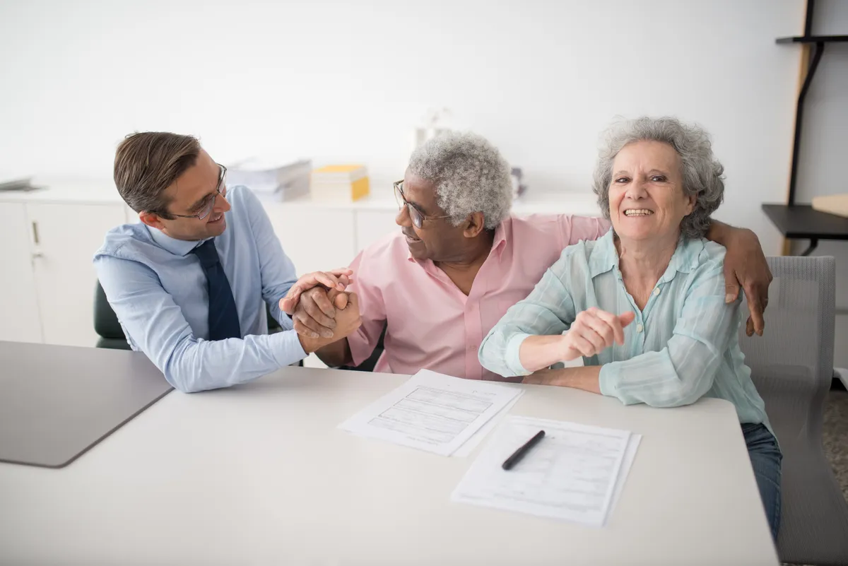 Three Oaks estate sale consultant reviewing a custom plan with clients during a free in-home consultation