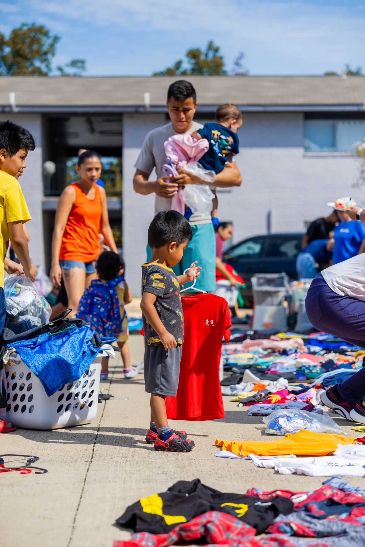 Shoppers browsing and buying items on estate sale day